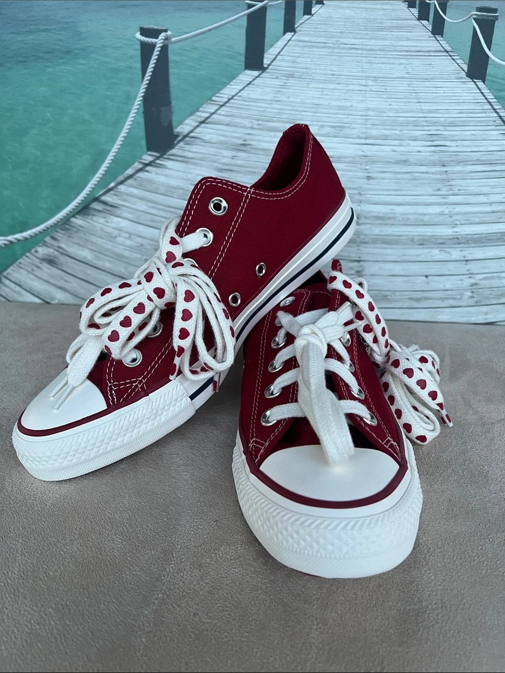 Converse Women's Low Top Sneakers in Burgundy with Heart-Print Laces